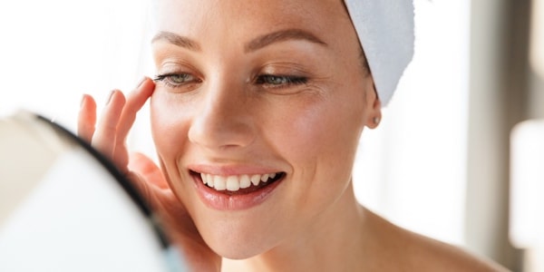 Woman looking at reconstructive eye surgery results in Iowa from Wolfe Eye Clinic.